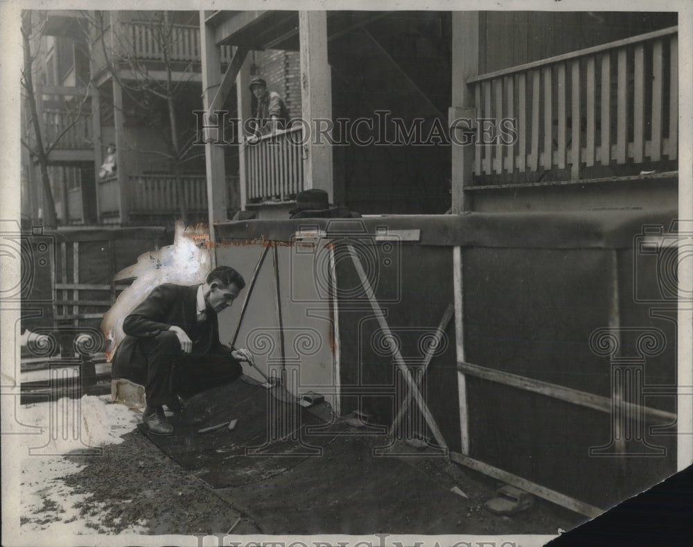 1926 man inspecting area outside of apartments in Chicago - Historic Images