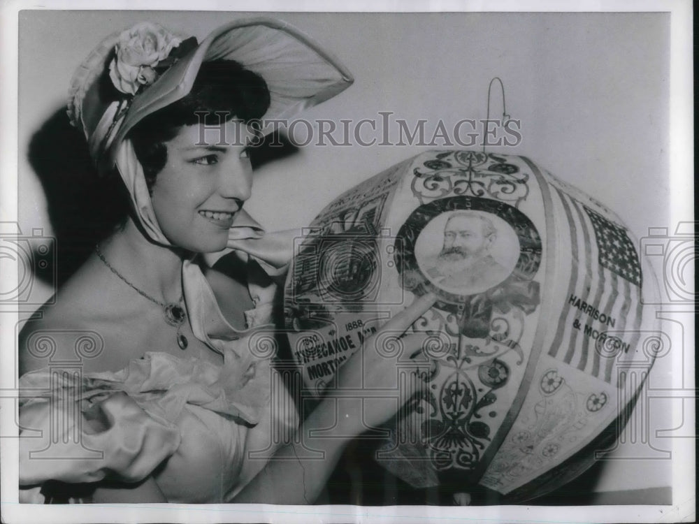 1955 Billie Miller holds antique sample of political advertising-Historic Images