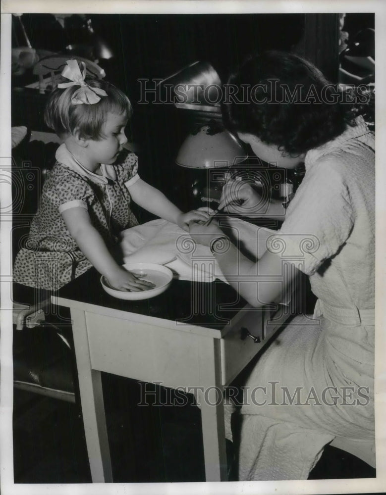 1939 Press Photo A young girl getting a manicure-Historic Images