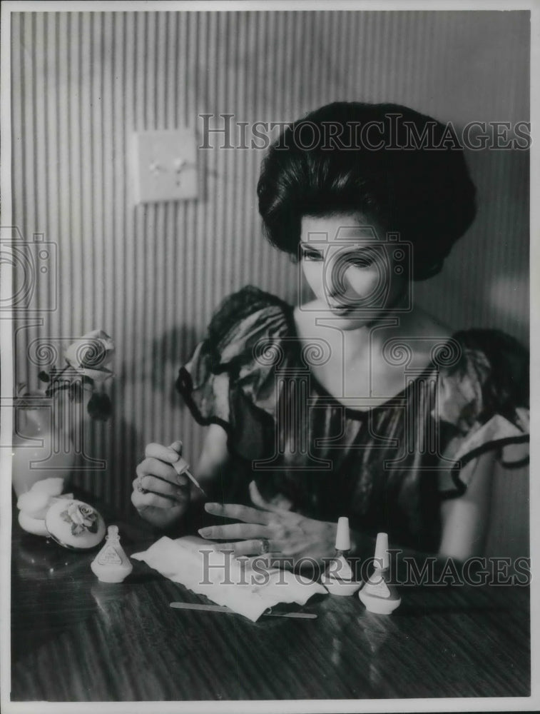 1961 Lady Painting Nails with Base Coat to Strengthen Nail-Historic Images