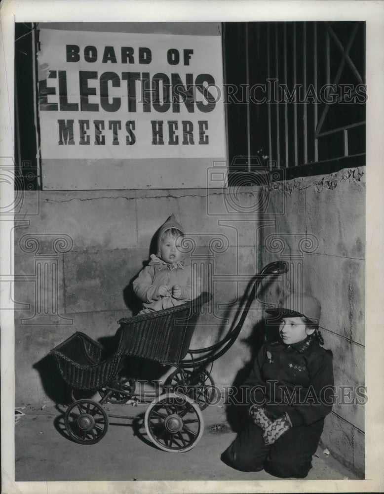 1944 Ellen Levine &amp; little brother Laurence wait as mom votes, NYC - Historic Images