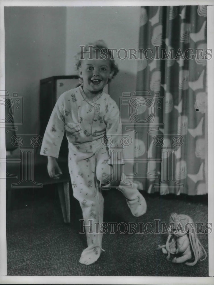 1949 A young child in a new set of pajamas - Historic Images