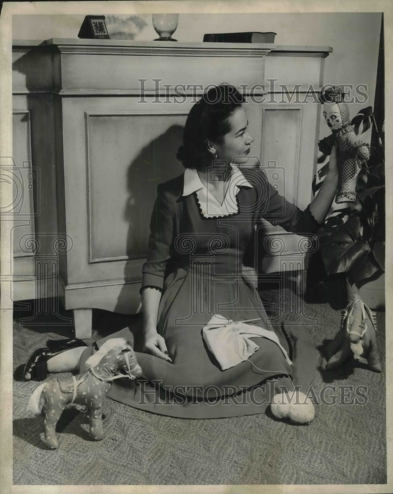 1942 Woman Looking at Toy Doll-Historic Images