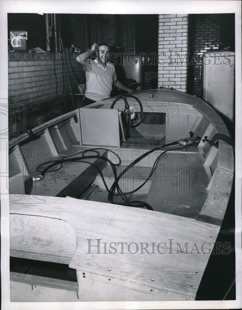 1955 Press Photo Joseph Weckstein Ponders Getting Motor Boat Out of NY Basement-Historic Images