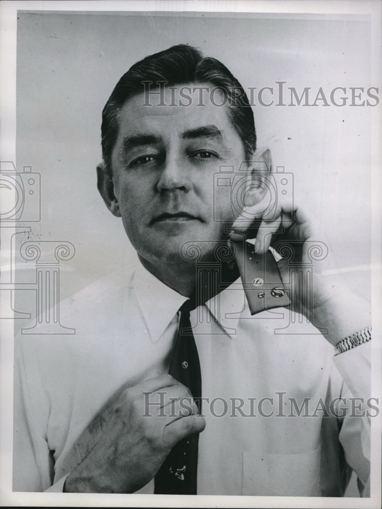 1956 Press Photo Ties A Bow Tie Thread it Under Collar - Historic Images