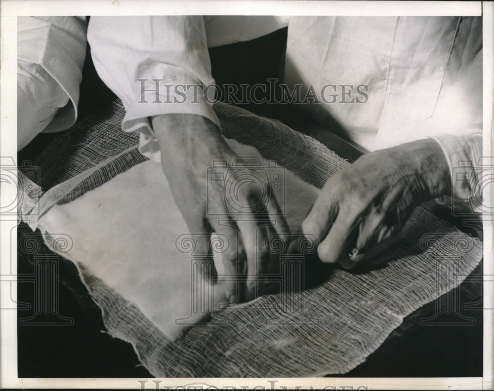 1942 Jacob Renz making surgical dressings for the Red Cross - Historic Images