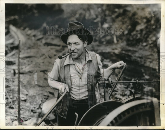 1937 Red Button laying railway steel with donkey engine in Canada-Historic Images