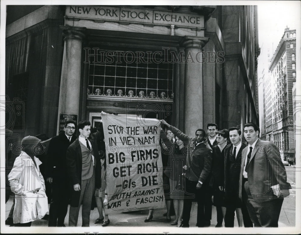 1966 Press Photo. Demonstrators hold a banner outside the NY Stock Exchange.-Historic Images