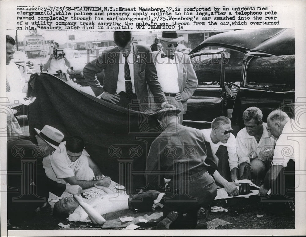 1958 Press Photo Ernest Wessberg, 37, comforted by an unidentified clergyman - Historic Images