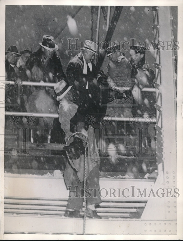 1935 One of the victims of a bus accident being brought to surface - Historic Images