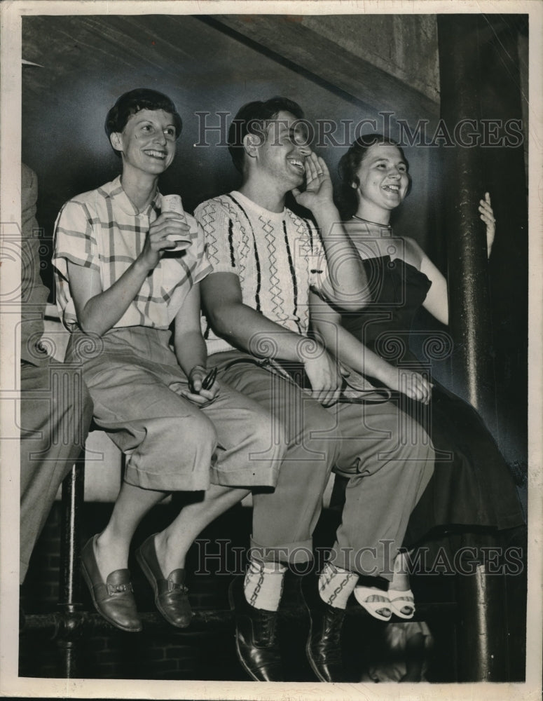 1950 Press Photo Three people in seats for sports game - Historic Images