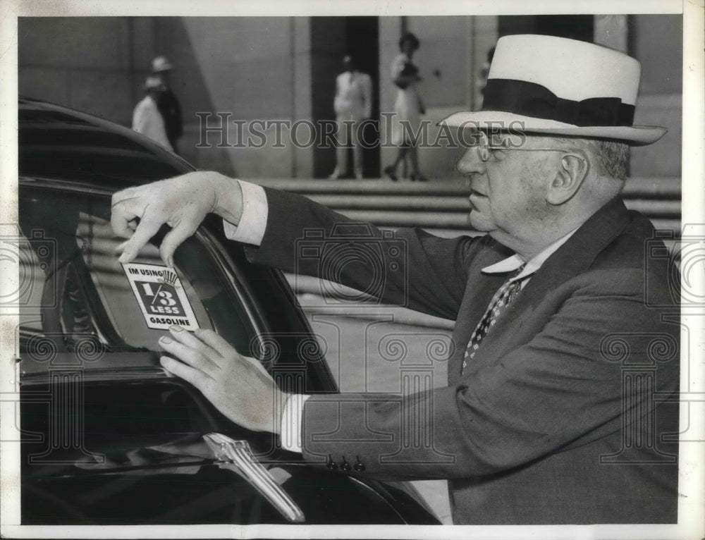 1941 Interior Secretary Harold Ickes Puts Gas Conservation Sticker - Historic Images