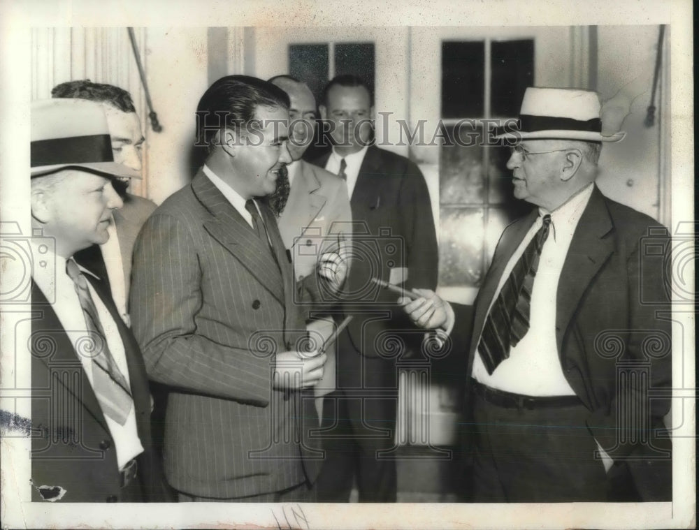 1939 Press Photo Secretary of Interior Howard Ickes Passing Out Cigars for Birth-Historic Images