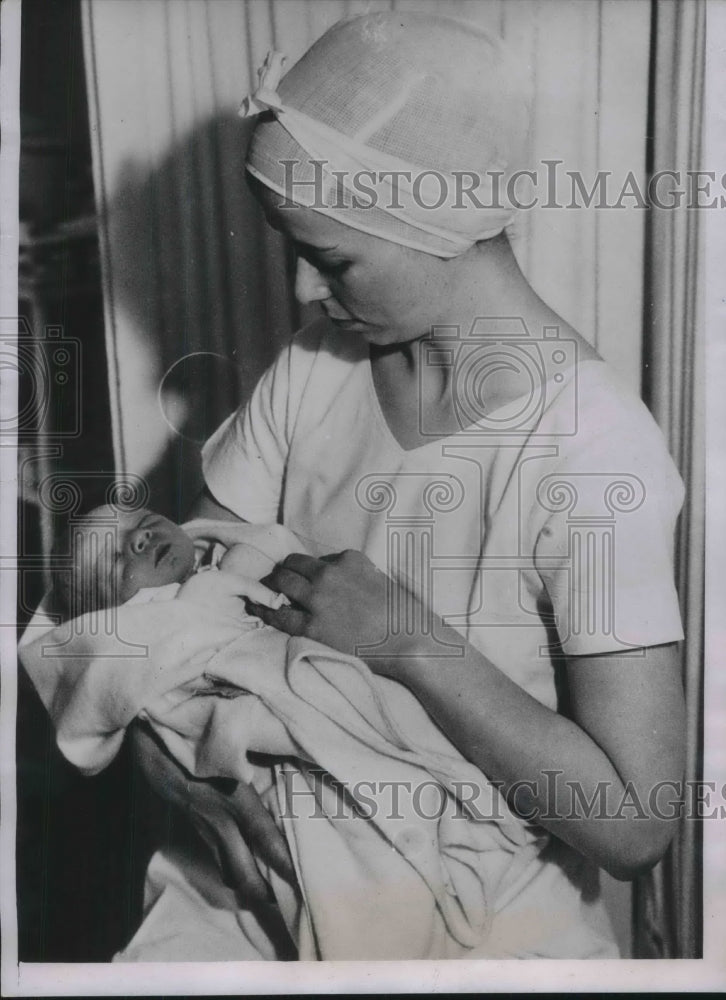 1935 Nurse Vera McKrell Holds baby born to 13 year old - Historic Images