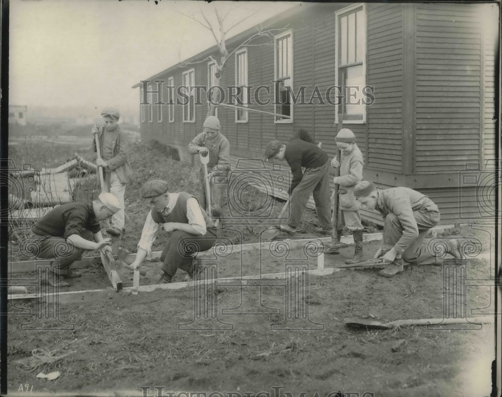 1919 Press Photo Youth digging for a foundation at Mooseheart. - Historic Images