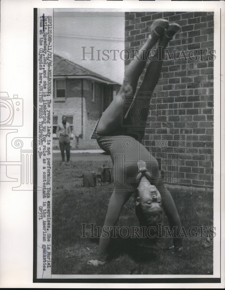 1956 Press Photo Olympic Gymnast Muriel Davis limbering up before a show - Historic Images