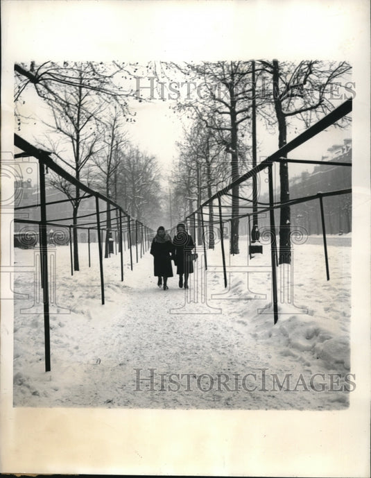 1945 Paris, France lasies stroll in snow in a park-Historic Images