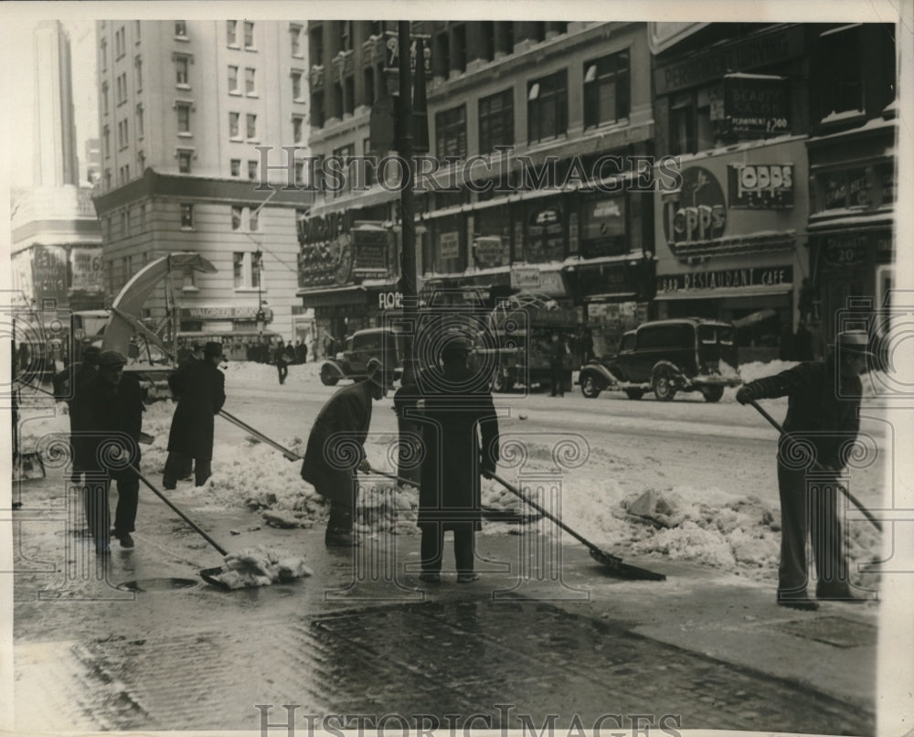 1940 NYC workers removing snow at 42nd St after severe snow storm - Historic Images