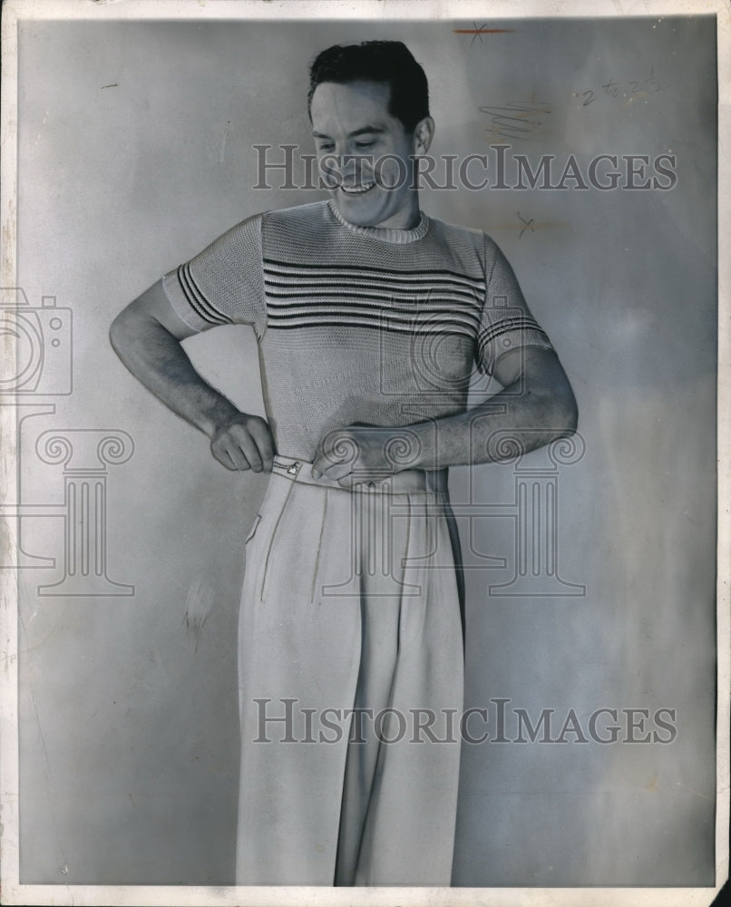 1950 Man Models Sports Outfit of Light Pants &amp; Short Sleeve Sweater - Historic Images