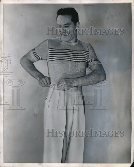 1950 Man Models Sports Outfit of Light Pants & Short Sleeve Sweater - Historic Images