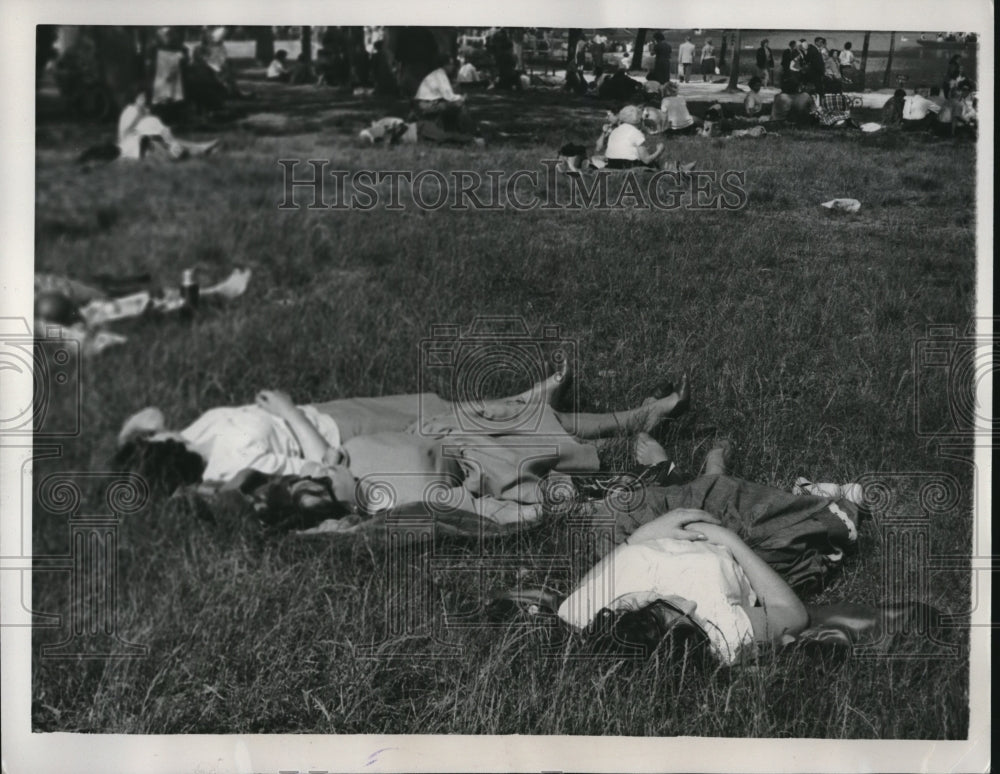 1961 Stretching out in Grass at Bois De Vincennes in Paris - Historic Images