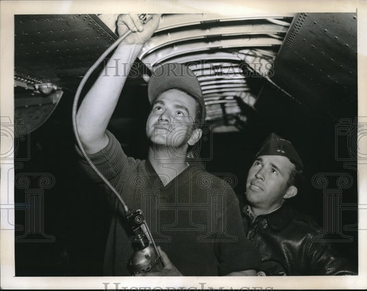 1944 Britain, Sgt Joseph Griff,Capt Albert Gill work on a plane-Historic Images