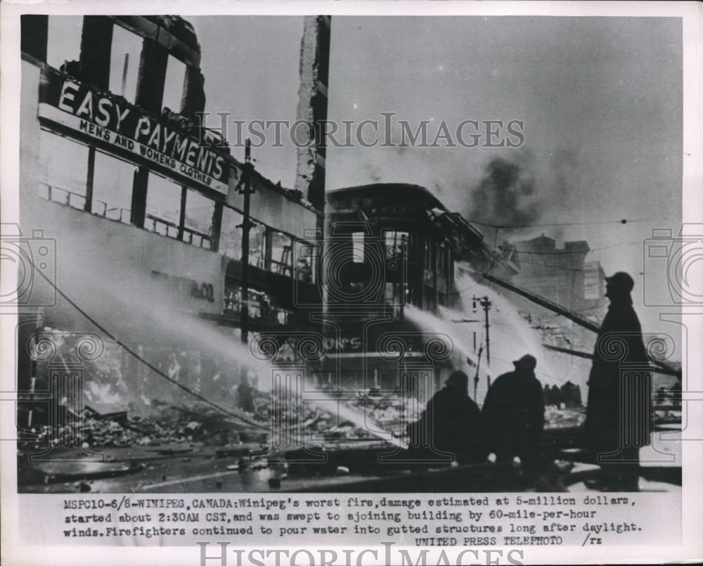 1954 Press Photo Firefighters fighting fire in Winipeg Canada - Historic Images