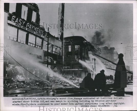 1954 Press Photo Firefighters fighting fire in Winipeg Canada - Historic Images