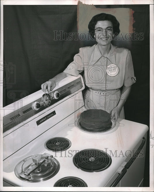 1952 Mrs SP Weston w/ her new electric stove & oven - Historic Images