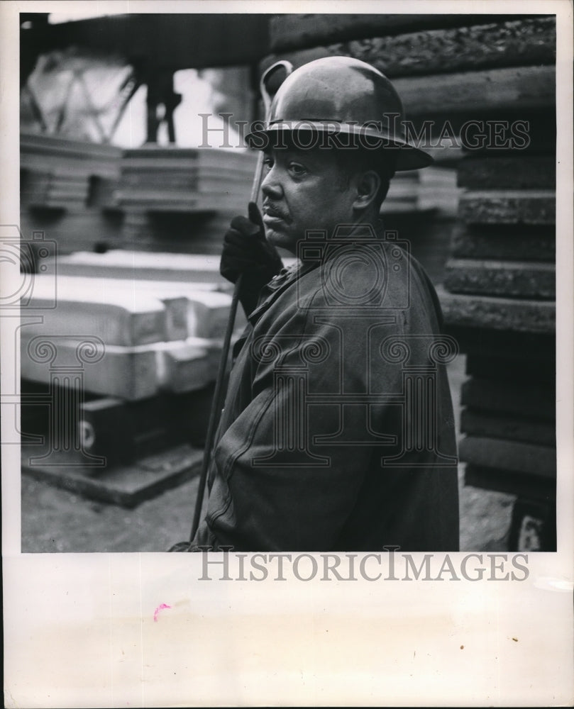 1953 Car Loader Wearing a Hard Hat - Historic Images