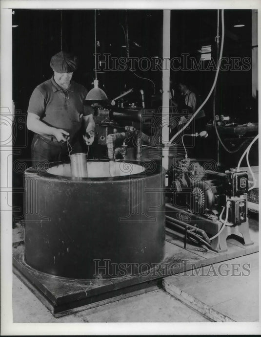 1942 Man Working Reciprocating Machine at Easy Washer Manufacturing - Historic Images