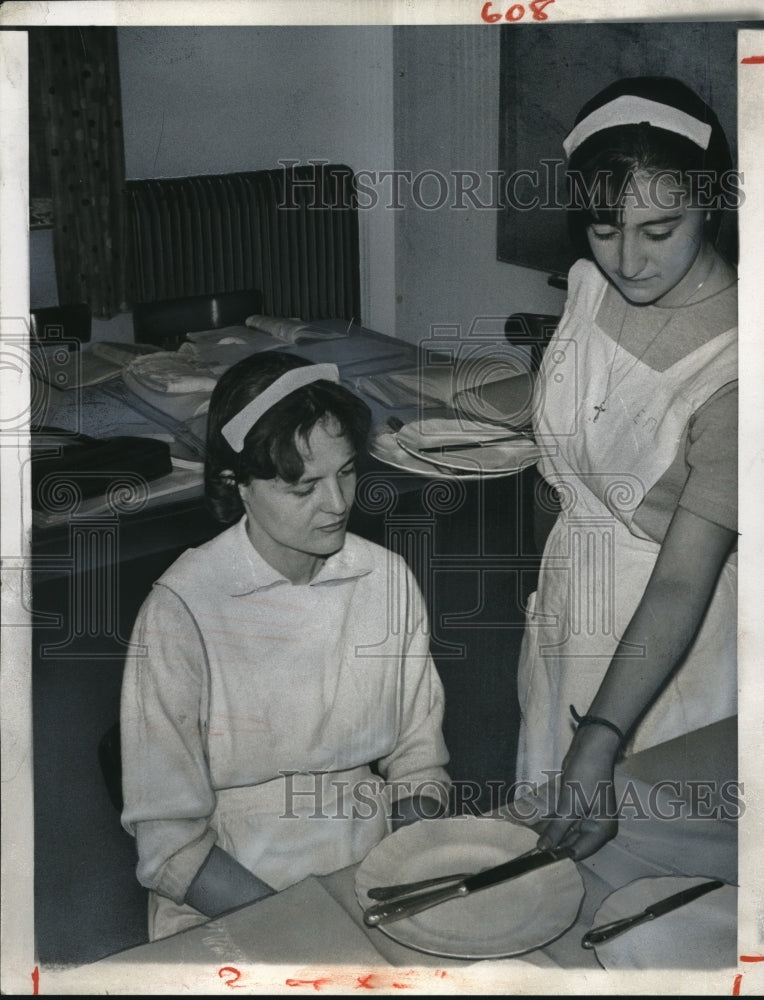 Greek woman learning table setting etiquette - Historic Images