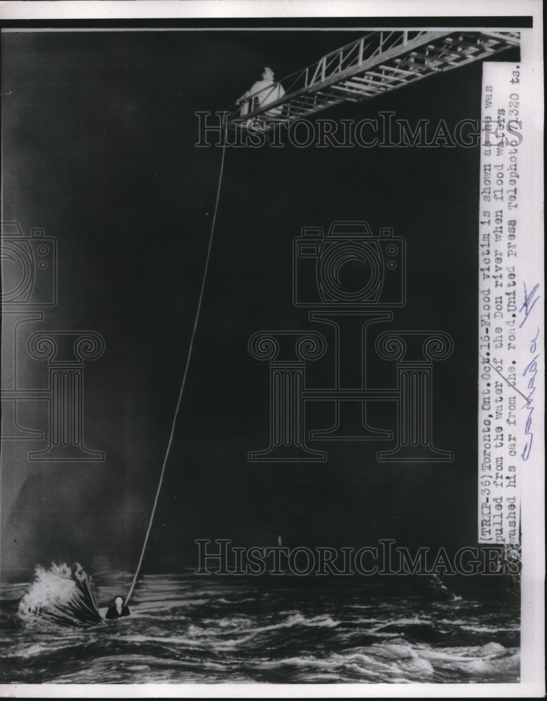 1964 Press Photo Flood Victim Pulled From Flood Waters Near Toronto-Historic Images