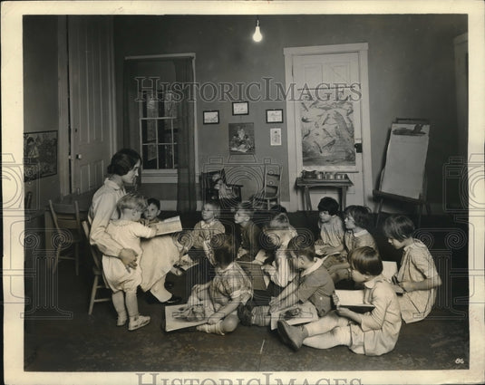1931 Nursery school teacher & her calss in student teacher training - Historic Images