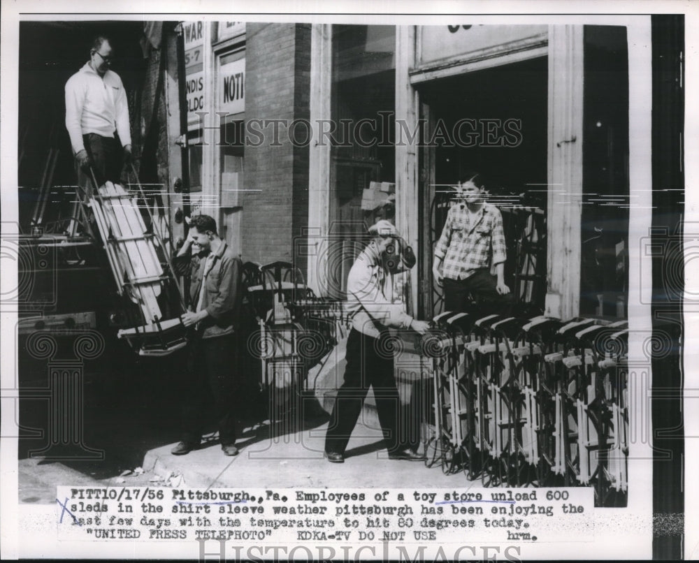 1956 Toy Store Workers Unload Sleds in Warm Weather for Pittsburgh - Historic Images