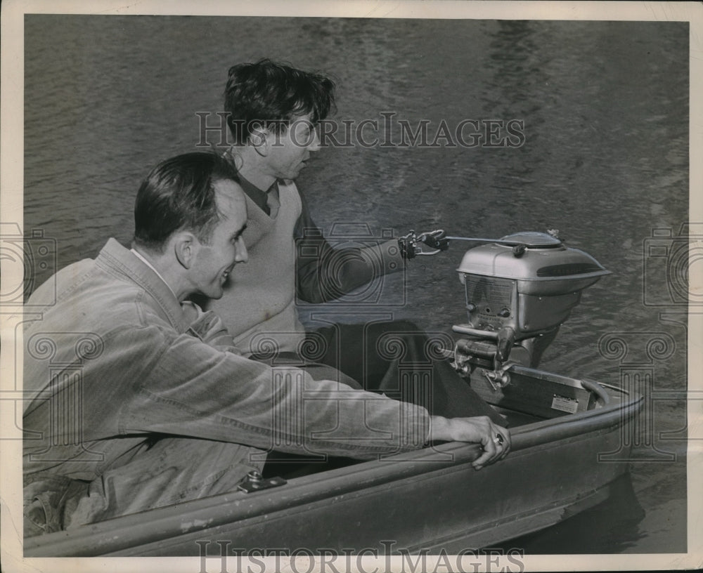 1946 Sgt. Aaron Spector with Jack Fouche Start Outboard Motor - Historic Images