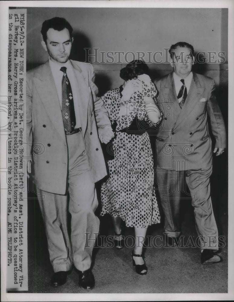 1951 Press Photo Mrs Harry Gross escorted by Detective George McGowan - Historic Images