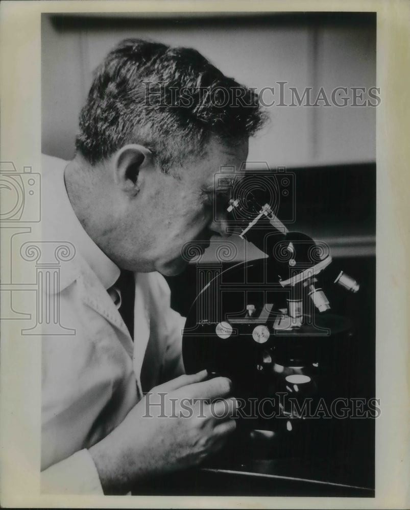 A doctor doing his research for the American Cancer Society - Historic Images