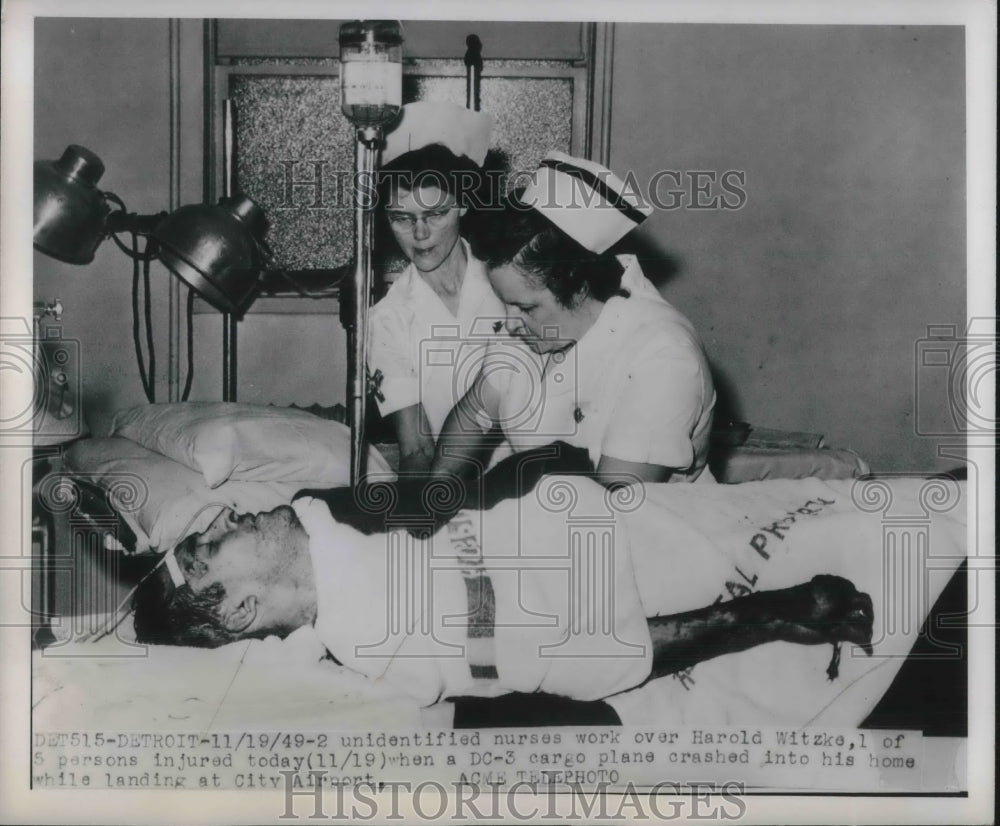 1949 Nurses working on Harold Witzke injured from aircraft crash - Historic Images