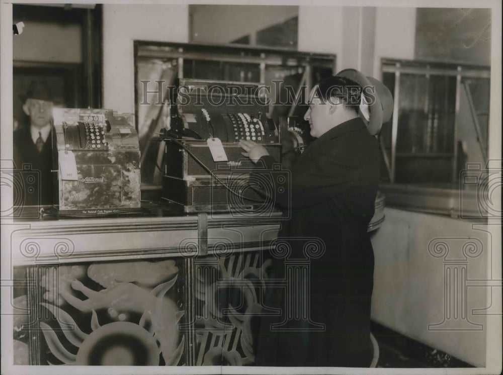 1936 Harry August Looking At Cash Registers - Historic Images