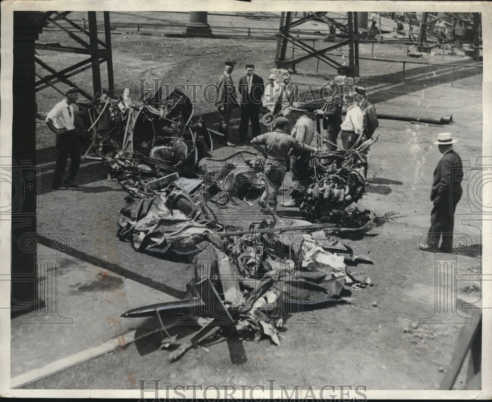 1930 Aviation experts summoned to look over wreckage of plane crash - Historic Images