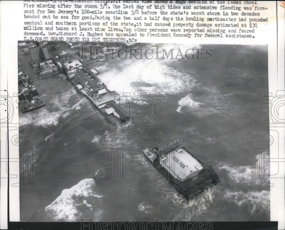 1962 Aerial view of ships &amp; piers swamped by high tides in NJ - Historic Images