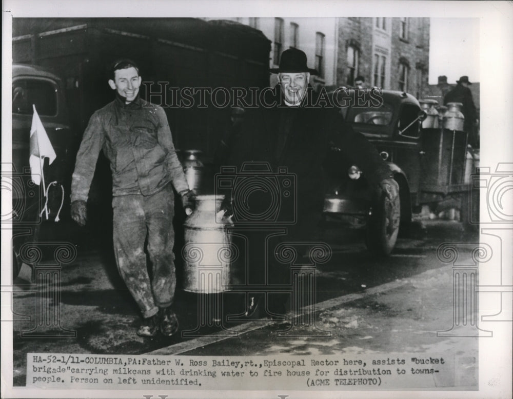 1951 Press Photo Father W. Ross Bailey assisting &quot;Bucket Brigade&quot; - neb97084 - Historic Images