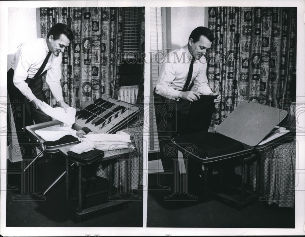 1954 A man packing his clothes in a suitcase - Historic Images