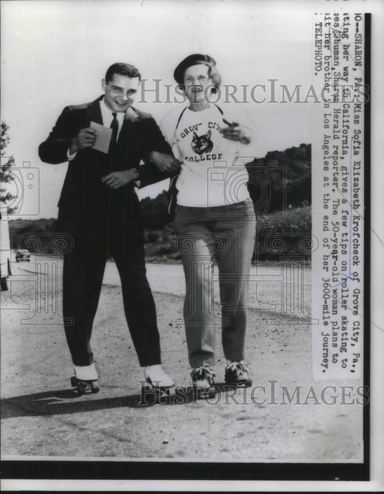 1958 Press Photo Sofia Elizabeth Krofcheck Giving Rollerskating Tips to Mr Shuma - Historic Images