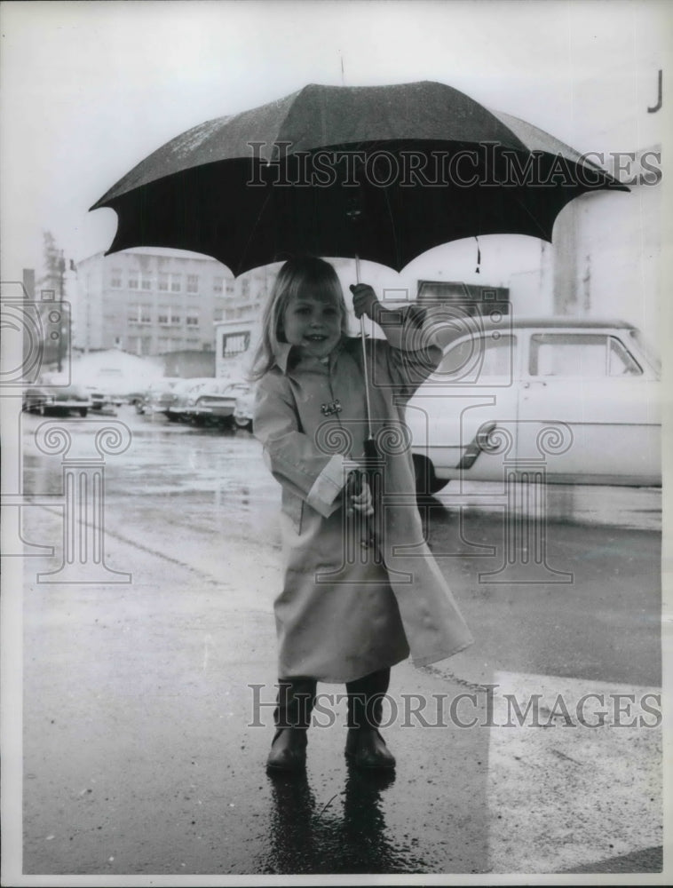 1961 3 Year Old Kim Vestal In The Rain. - Historic Images