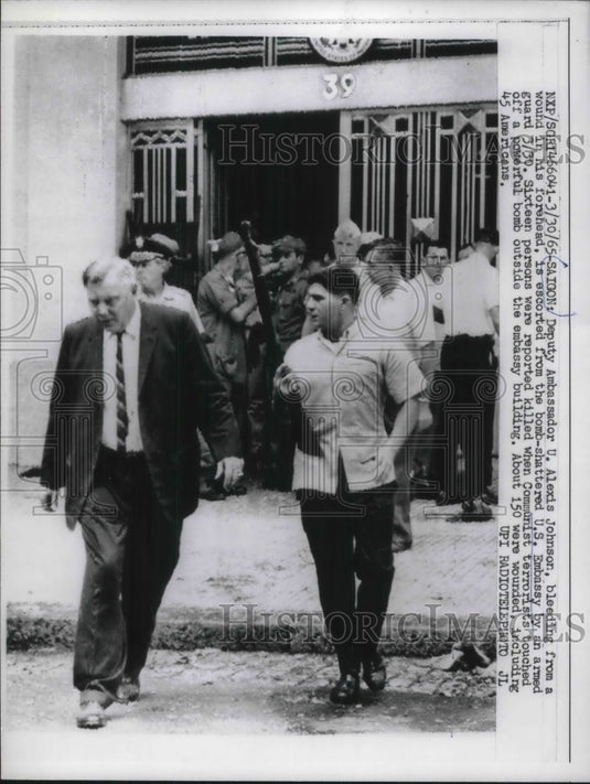 1965 Press Photo Deputy Ambassador U Alexis Johnson Escorted From Scene-Historic Images