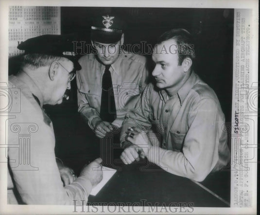 1949 Press Photo Andy St Cott questioned in Akron, Ohio, plane tires slashed - Historic Images