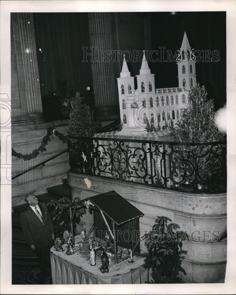 1955 Conrad Hilton in lobby of Conrad Hilton Hotel at Christmas - Historic Images