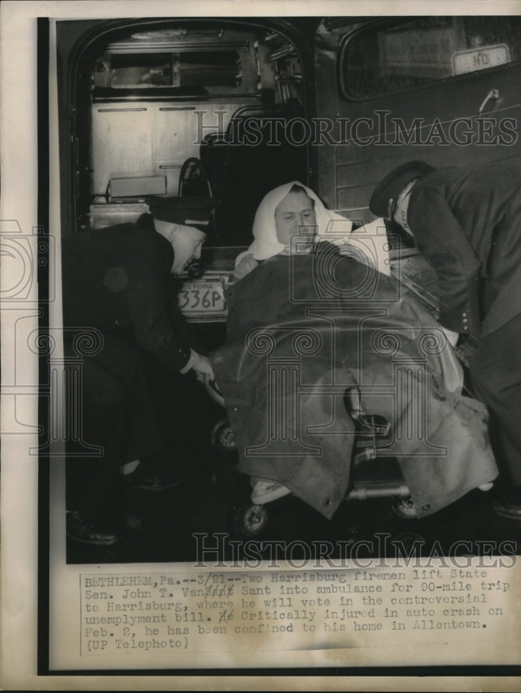 1955 Press Photo Two Firemen life State Sen. John T. VanSant into an Ambulance-Historic Images